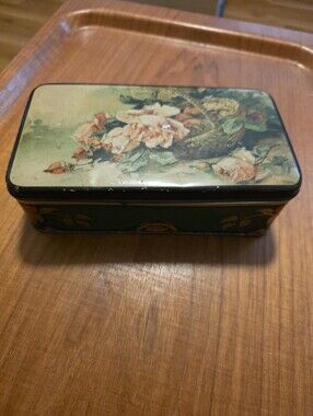 Victorian-style biscuit tin featuring a lithographed floral.